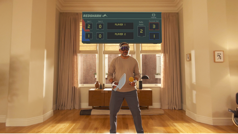 A person playing a game in Apple Arcade on Apple Vision Pro, using a connected controller.