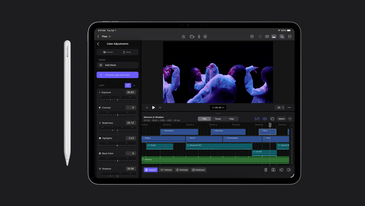 iPad Pro 13 screen showing colour adjustment panel on the left, a woman dancing in moody lighting on the right, a video clip timeline at the bottom, Apple Pencil to the left of the device